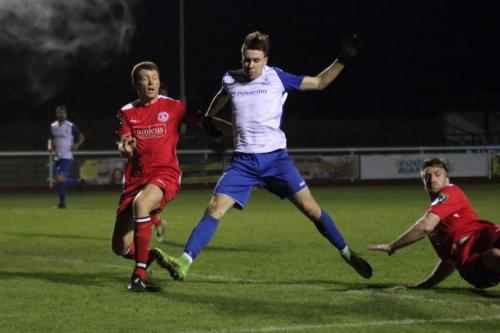 Chipsteads Sam Page (L) clears from Ben Ward-Cochrane