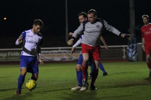 Enfields Jack Hockney (L) cant capitalise on Tony Stones fumble