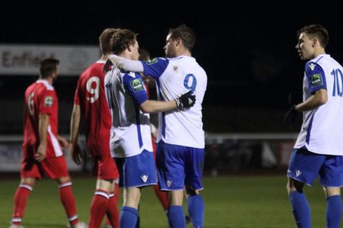 Enfileds Liam Hope (white no 9) and Ben Ward-Cochrane celebrate with Aaaron Greene after Greenes penalty put Enfield 3-2 up