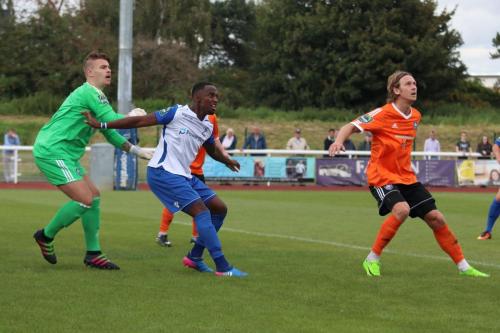 Met keeper Luke Williams, Enfields Ryan Blake and Mets Will Salmon wait for a corner to arrive