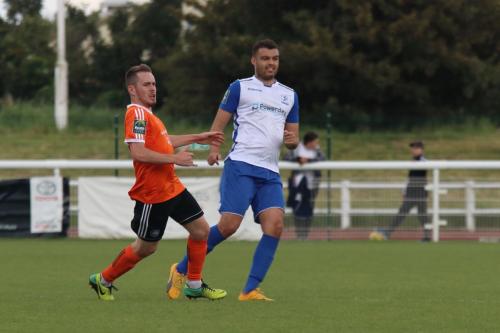 Mets Joshua Webb (L) and Enfields Taylor McKenzie