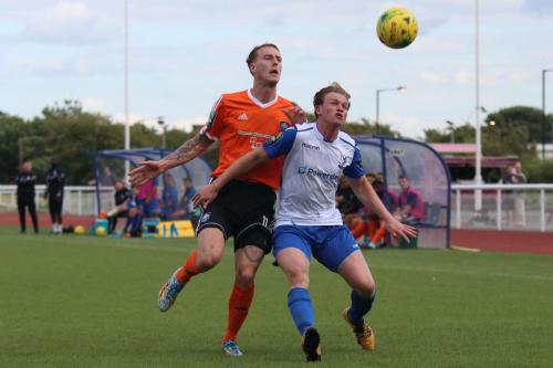 Mets Lewis Putman (L) and Enfields Aaron Greene