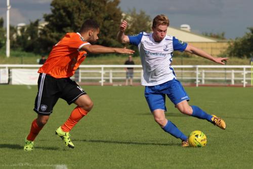 Mets Rylan Myers (L) and Enfields Aaron Greene