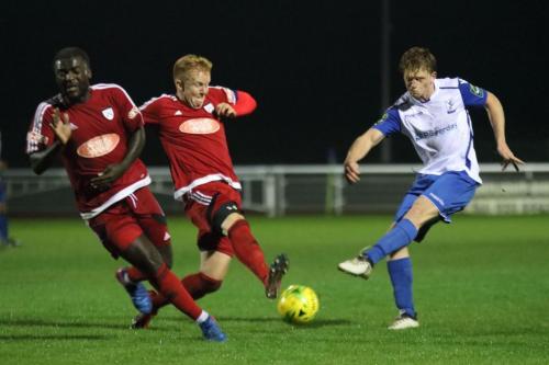 Enfields Aaron Greene shoots as Georges Ehui (L) and Oliver Duffy try to block