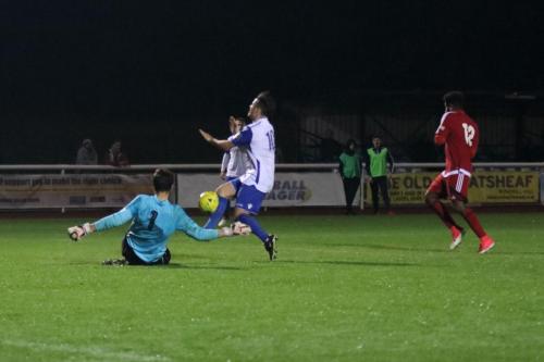 Enfields Drew Roberts (10) is just beaten to the ball by Xavi Comas