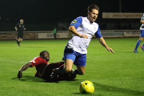Hanwells Georges Ehui brings down Drew Roberts to concede a penalty
