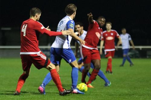Hanwells Nick Turner (4) challenges Sam Youngs while Ruddock Yala gives directions