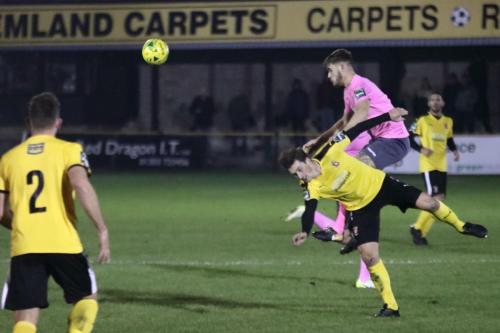 Enfields Dan Rumens (pink) challenges Sam Hasler