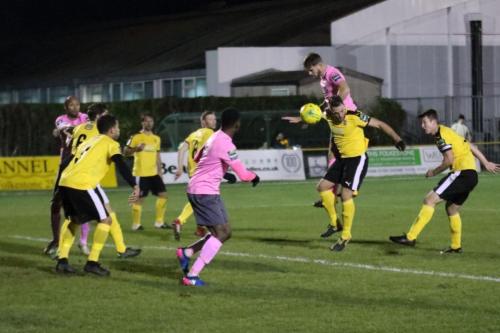 Enfields Dan Rumens (pink, R) wins a header but sends the ball wide163
