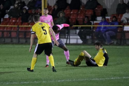 Enfields Ryan Blake (pink) challenged by Ian Draycott