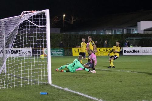 Enfields Simon Thomas (pink) beats Invicta keeper Tim Roberts but is offside