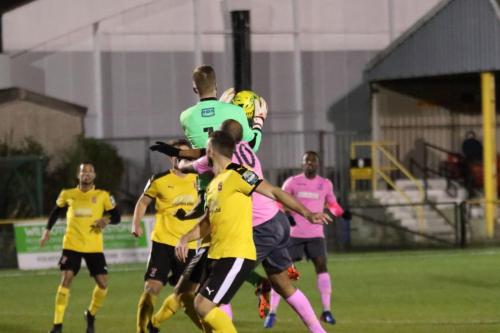Invicta keeper Tim Roberts beats Simon Thomas (10) to a cross