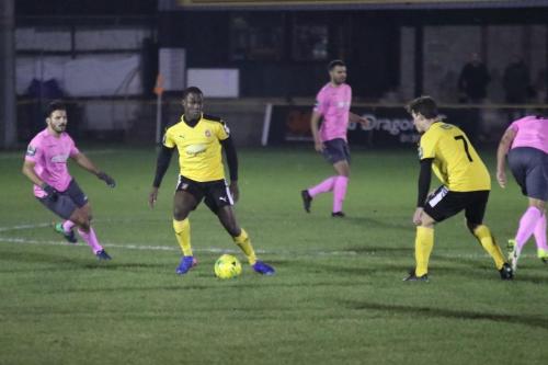 Invictas Ade Yusuff (amber, L) and Sam Hasler and Enfields Mario Noto