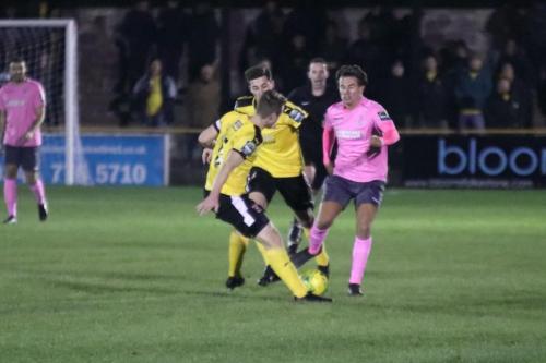 Invictas Callum Davies (amber) clears from Sam Youngs