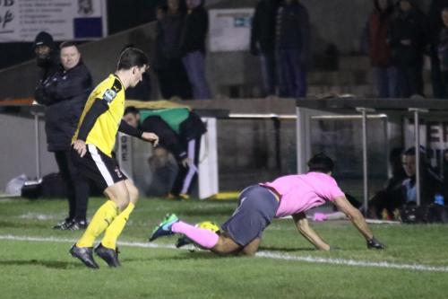 Invictas Sam Hasler (L) and Enfields Mario Noto