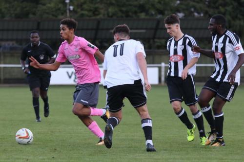 Enfields Montell Moore and (L-R) Hanwells Charlie Mitchell, Harvey Killeen and Glen Yala