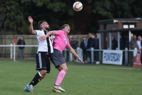Hanwells Peter Dean (L) challenges Aaron Greene
