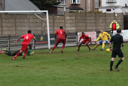 Enfields Brad Wadkins cant reach (yellow) the ball after keeper Melvin Minters deflection