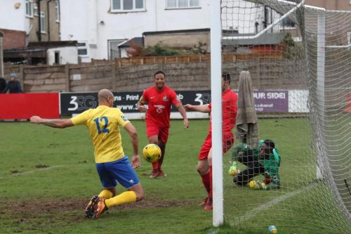 Enfields Simon Thomas (12) tries to chest the ball over the line but George Moore is able to block by the post65