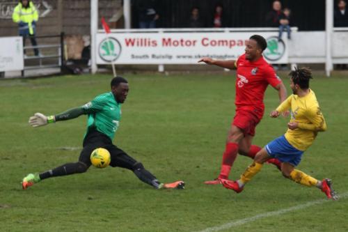Harrow keeper Melvin Minter saves from Tyler Campbell