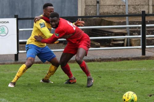 Harrows Adam Pepera (R) holds off Ryan Blake