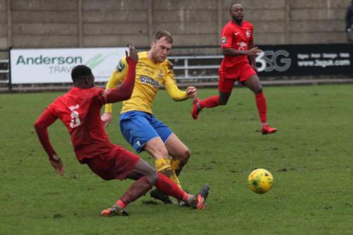 Harrows Adam Pepera (red) challenges Brad Wadkins