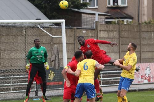 Harrows Adam Pepera (red,L) heads clear