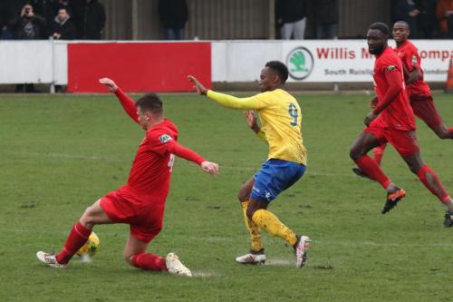 Harrows Adam Richards (L) beats Ryan Blake to the ball