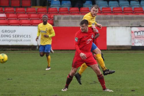 Harrows Adam Richards (red) and Enfields Brad Wadkins