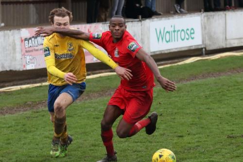 Harrows Chinua Cole (R) appears to catch Mickey Parcell with his arm