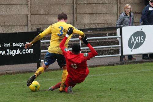 Harrows Kurtis Cumberbatch (R) makes a perfect tackle on Aaron Greene to put the ball out of play for a corner