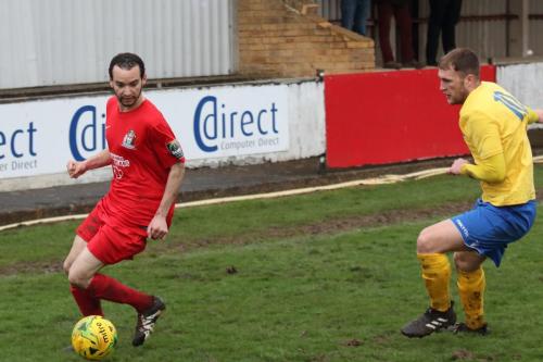 Harrows Michael Bryan (L) and Enfields Brad Wadkins