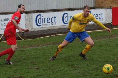 Harrows Michael Bryan (L) and Enfields Brad Wadkins63