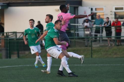 Enfields Ryan Blake (pink) just fails to get his head to a cross