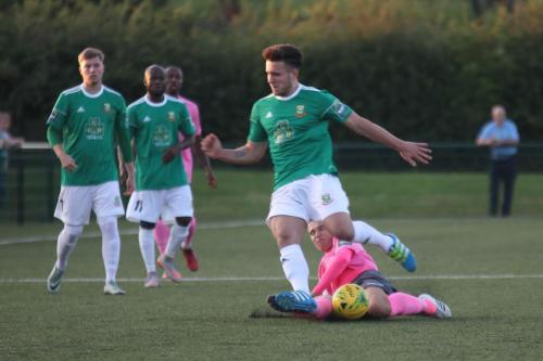 Enfields captain Mickey Parcell (pink shirt) chalenges Luke Tingey