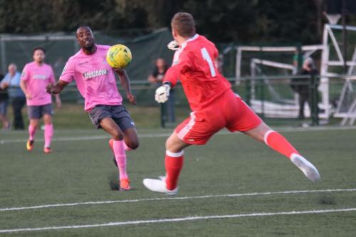 Hendon keeper Tom Lovelock clears from Ralston Gabriel