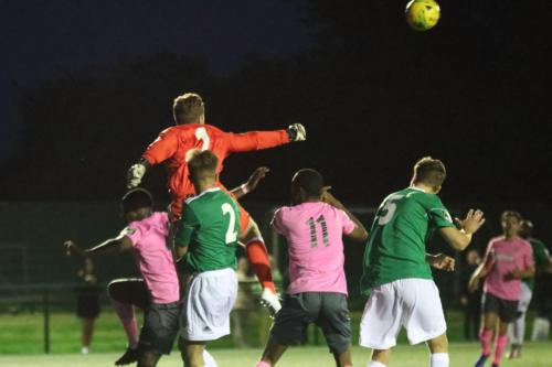 Hendon keeper Tom Lovelock punches clear