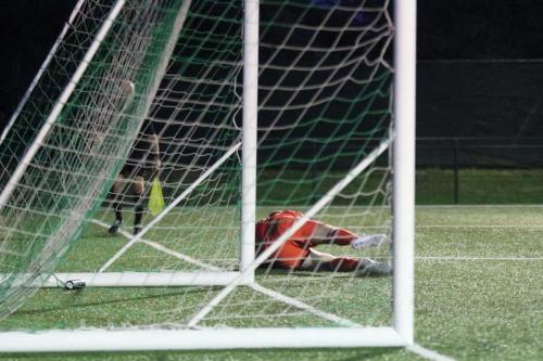 Hendon keeper Tom Lovelock smothers the rebound after saving Drew Roberts penalty