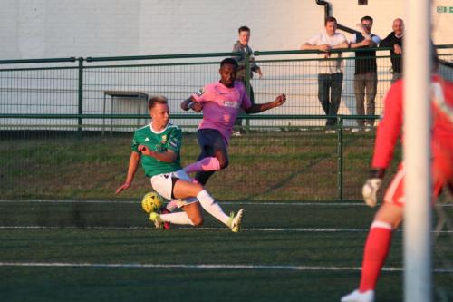 Hendons Jake Eggleton (green) blocks Ryan Blakes attempted cross