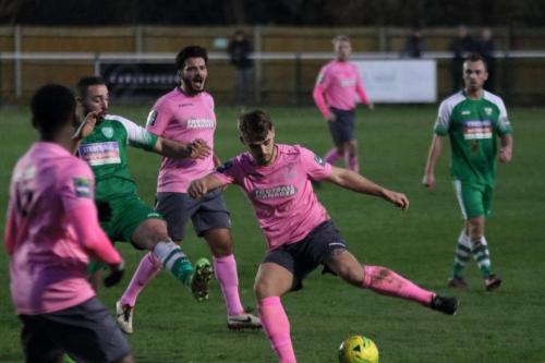 Enfields Dan Rumens tries to make room for a shot