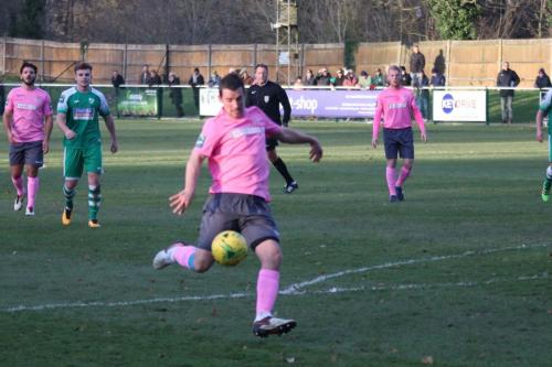 Enfields Elliot Benyon shoots across the face of goal