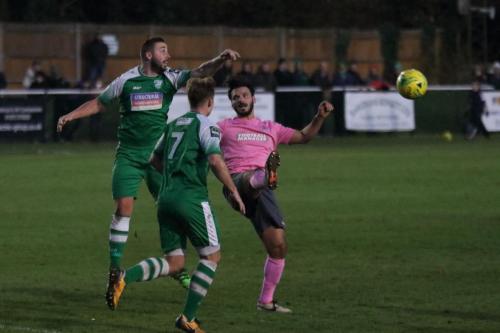 Enfields Mario Noto (R) challenges Sammy Moore175