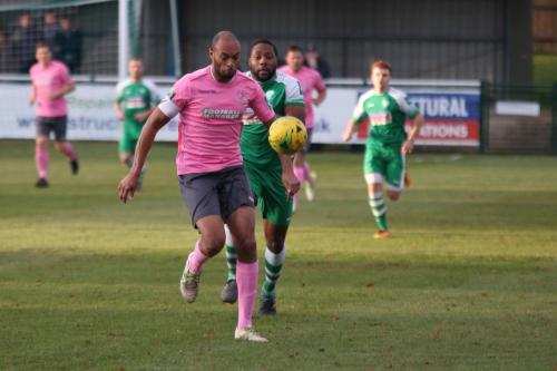 Enfields Simon Thomas (L) breaks clear of Jerry Nnamani