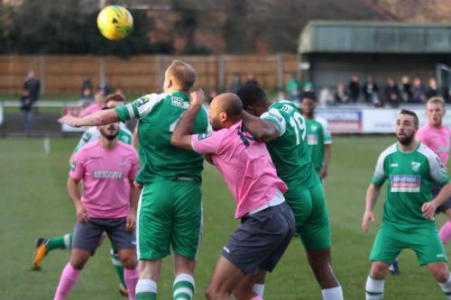 Enfields Simon Thomas closely marked by Jerry Nnamani (19) and Lee Minshull