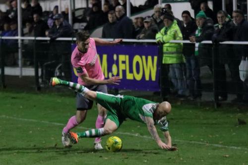 Enfields Steve Wales (L) brings down Sean Clohessy