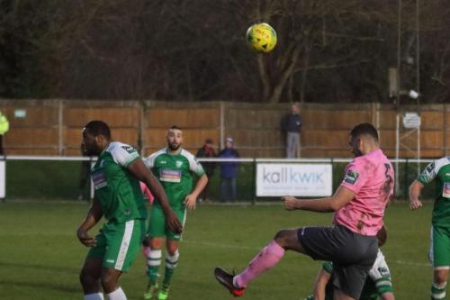 Enfields Taylor McKenzie (R) heads across goal173