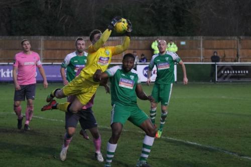 Leatherhead goalkeeper Zaki Oualah beats Elliot Benyon (pink) to the ball174
