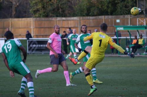 Leatherhead goalkeeper Zaki Oualah gets away with a sliced clearance