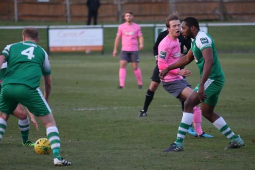 Leatherheads Jerry Nnamani (R) ends Mickey Parcells run