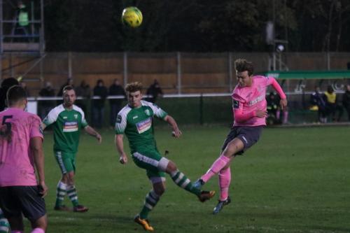 Leatherheads Sam Blackman deflects Mickey Parcells shot (R) for a corner